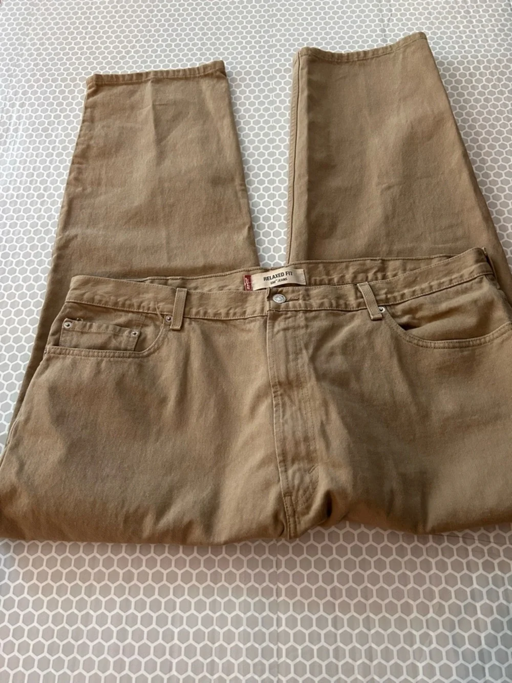 Levi's relaxed fit 550 jeans in khaki tan.  Size 44X30. Cotton
